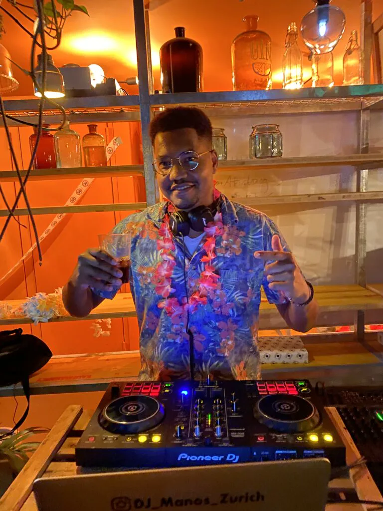 DJ Manoss mixing at a club night
